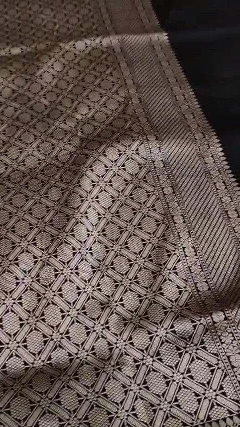 Black Banarasi handloom Katan silk Rangkaat Meenakari saree with intricate silver zari work and vibrant motifs.