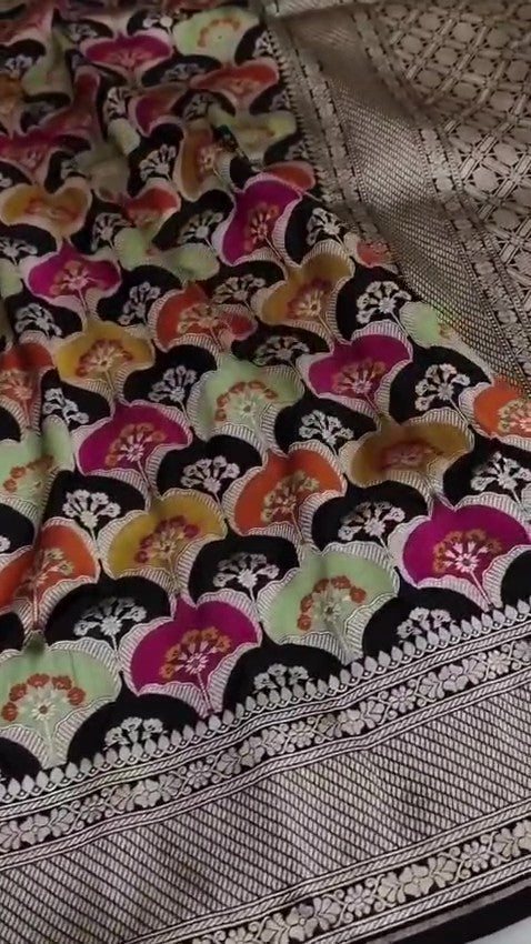 Black Banarasi handloom Katan silk Rangkaat Meenakari saree with intricate silver zari work and vibrant motifs.