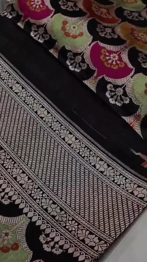 Black Banarasi handloom Katan silk Rangkaat Meenakari saree with intricate silver zari work and vibrant motifs.