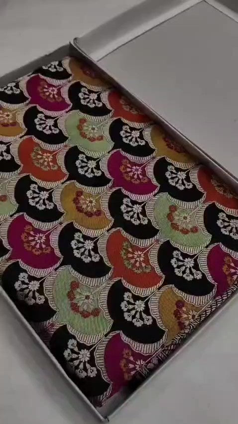 Black Banarasi handloom Katan silk Rangkaat Meenakari saree with intricate silver zari work and vibrant motifs.