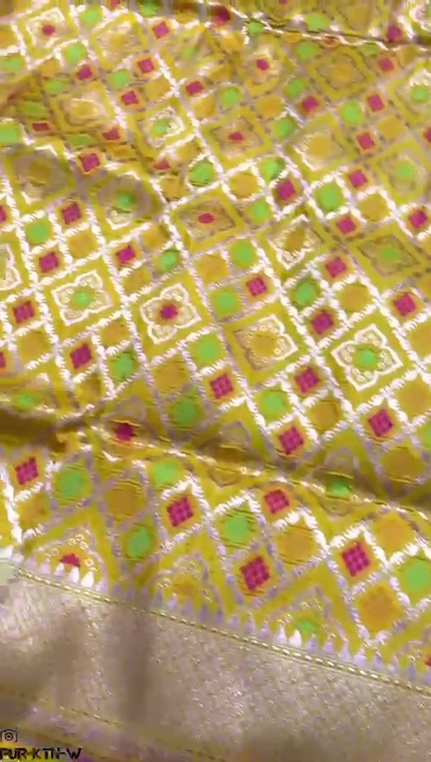 Radiant yellow Banarasi handloom pure katan silk saree featuring intricate gold zari and meenakari weaving