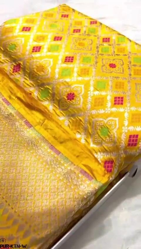Radiant yellow Banarasi handloom pure katan silk saree featuring intricate gold zari and meenakari weaving