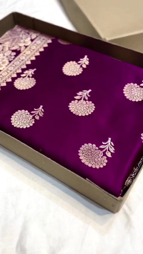 Dual-tone purple and magenta Banarasi Mashru soft silk saree featuring intricate copper zari borders, floral buta motifs, and a matching blouse