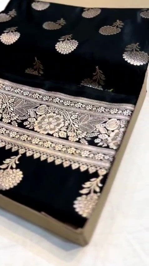Black Banarasi Mashru soft silk saree featuring intricate copper zari floral buttas and an ornate zari border.