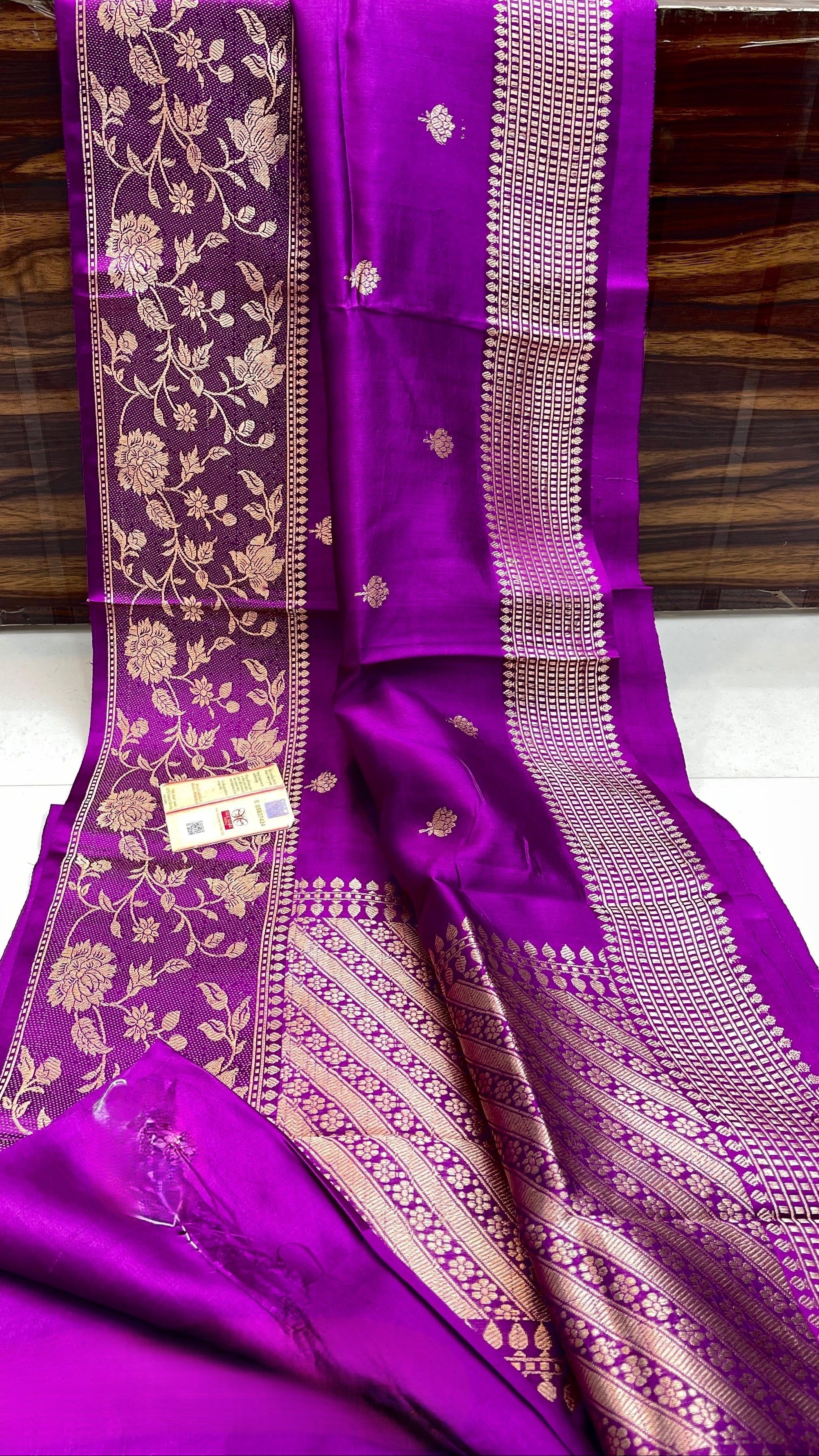vibrant purple Banarasi handloom raw mango silk saree featuring rich gold mashru borders and intricate Kaduwa weaving.