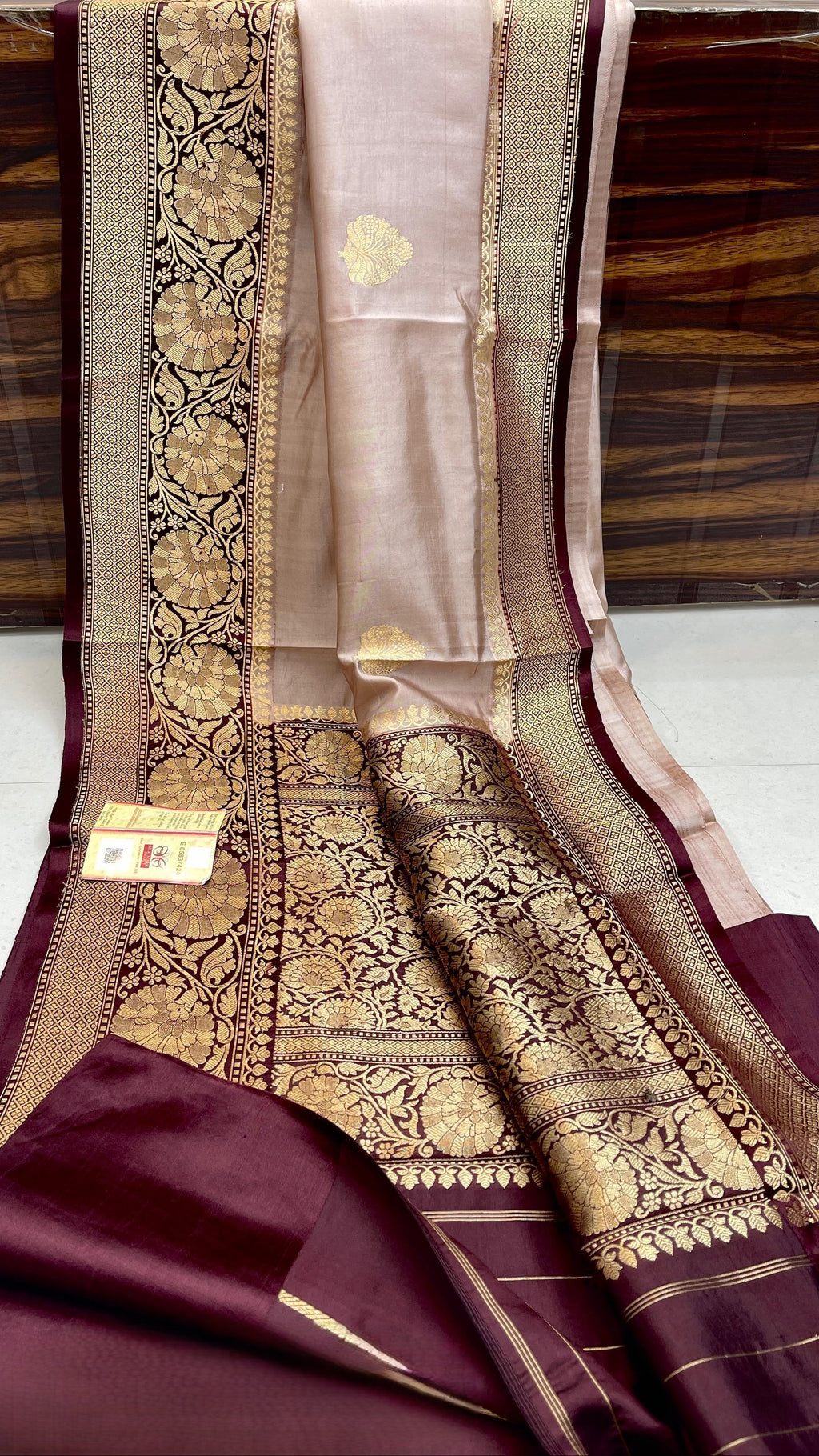 Elegant Beige Banarasi handloom raw mango silk saree with rich mashru borders and intricate Kaduwa weaving.