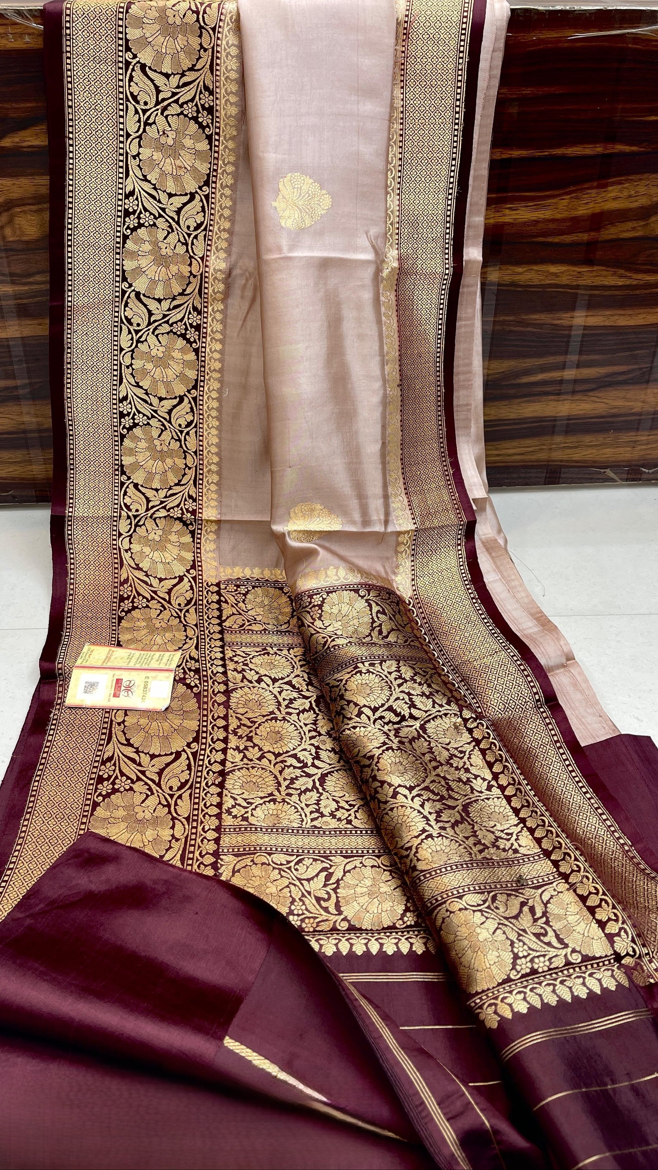 Elegant Beige Banarasi handloom raw mango silk saree with rich mashru borders and intricate Kaduwa weaving.