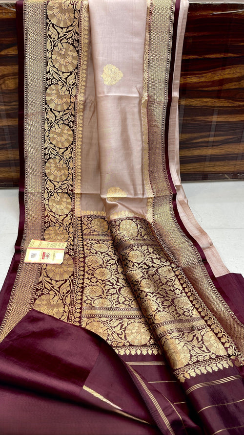 Elegant Beige Banarasi handloom raw mango silk saree with rich mashru borders and intricate Kaduwa weaving.
