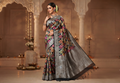Elegant model wearing a black Banarasi handloom Katan silk Rangkaat Meenakari saree with intricate silver zari work and vibrant motifs.