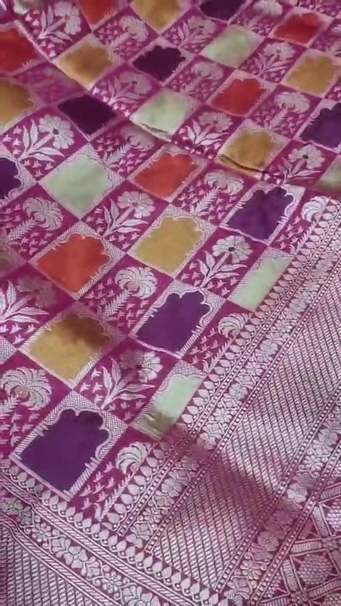 Elegant hot pink Banarasi handloom katan silk Rangkaat Meenakari saree featuring intricate zari weaving and vibrant multi-colored motifs.