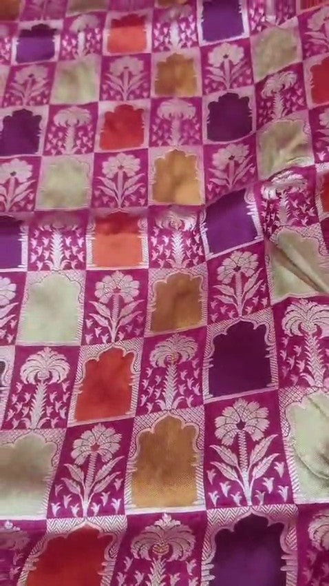 Elegant hot pink Banarasi handloom katan silk Rangkaat Meenakari saree featuring intricate zari weaving and vibrant multi-colored motifs.