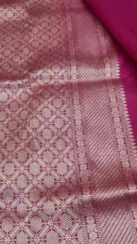 Elegant hot pink Banarasi handloom katan silk Rangkaat Meenakari saree featuring intricate zari weaving and vibrant multi-colored motifs.