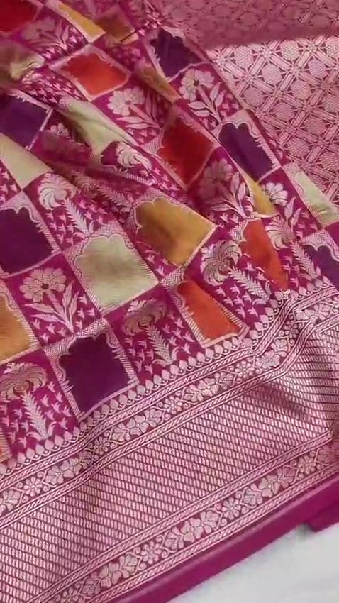 Elegant hot pink Banarasi handloom katan silk Rangkaat Meenakari saree featuring intricate zari weaving and vibrant multi-colored motifs.