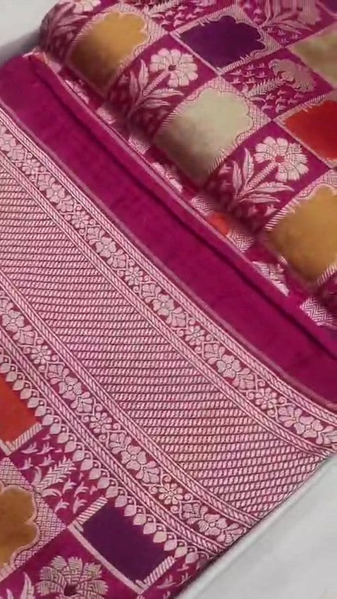 Elegant hot pink Banarasi handloom katan silk Rangkaat Meenakari saree featuring intricate zari weaving and vibrant multi-colored motifs.