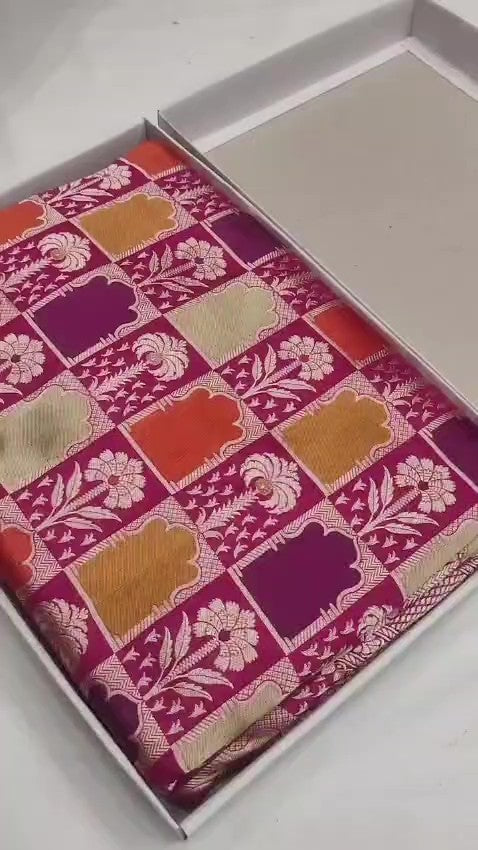 Elegant hot pink Banarasi handloom katan silk Rangkaat Meenakari saree featuring intricate zari weaving and vibrant multi-colored motifs.