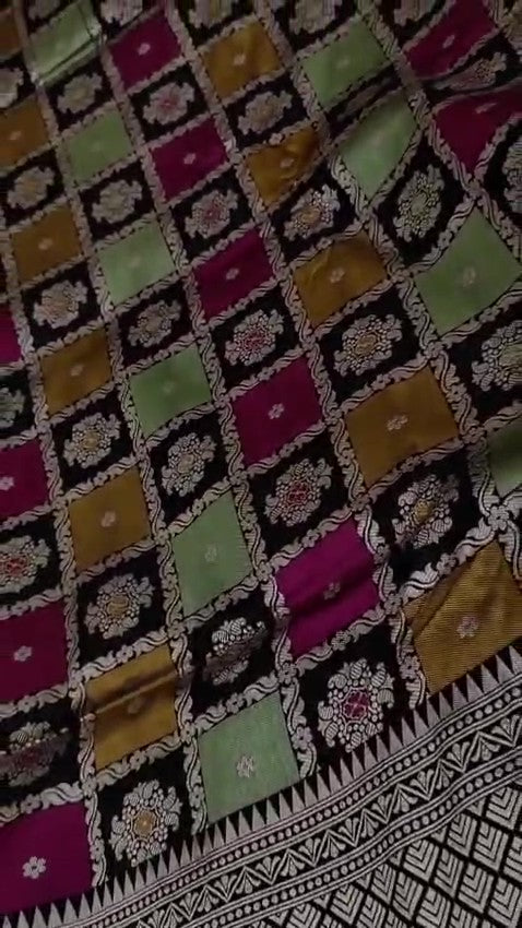 Black Banarasi Handloom Rangkaat Katan Silk Saree featuring multicolored checks, intricate motifs, and a rich silver zari pallu.