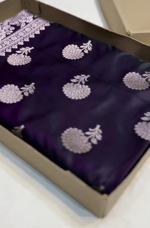 Dark purple Banarasi Mashru soft silk saree featuring elaborate silver and gold zari borders and matching floral motifs.