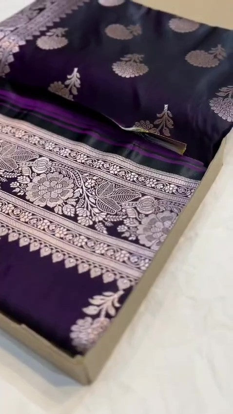 Dark purple Banarasi Mashru soft silk saree featuring elaborate silver and gold zari borders and matching floral motifs.