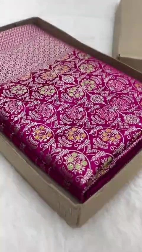 Hot pink Banarasi mashru soft silk saree detailed with all-over golden zari floral jangla weaving, meenakari highlights, and intricate zari borders.
