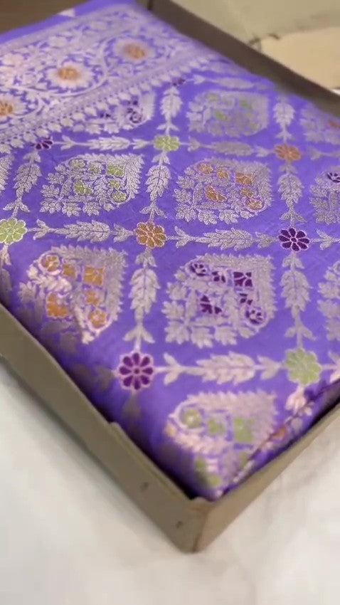 Violet Banarasi handloom pure Chiniya silk saree featuring elaborate silver and gold sona roopa meenakari floral motifs and a broad zari border.