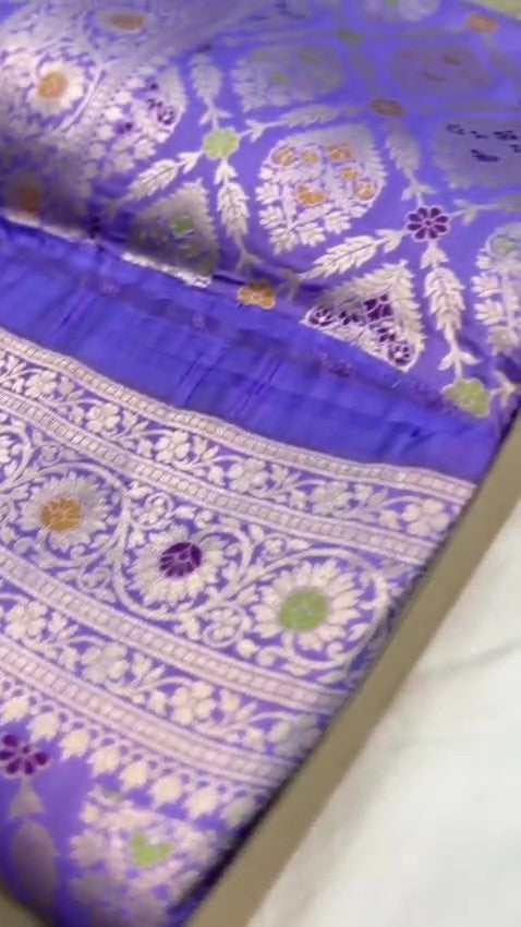 Violet Banarasi handloom pure Chiniya silk saree featuring elaborate silver and gold sona roopa meenakari floral motifs and a broad zari border.