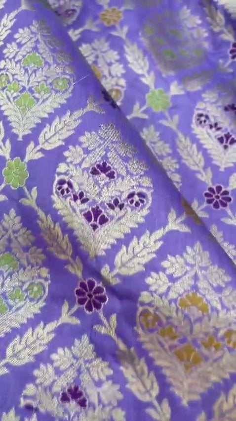 Violet Banarasi handloom pure Chiniya silk saree featuring elaborate silver and gold sona roopa meenakari floral motifs and a broad zari border.