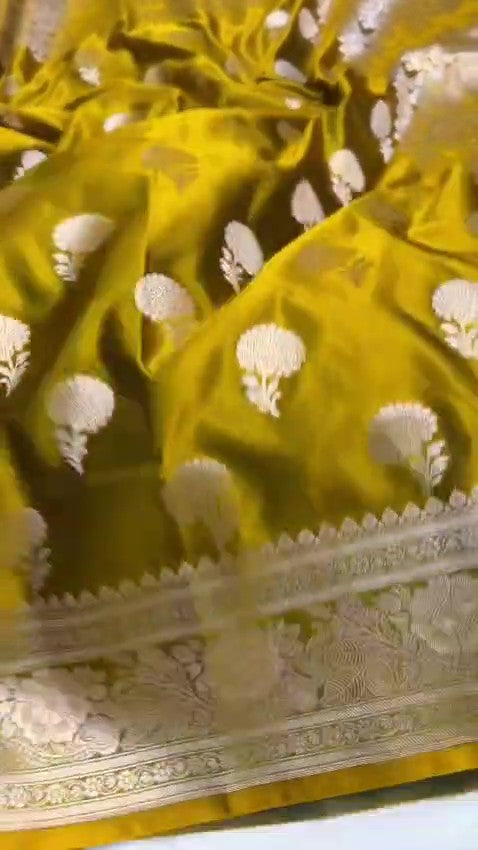 Olive Mustard Banarasi Mashru soft silk saree featuring intricate copper zari floral butas and an ornate traditional silver zari border.