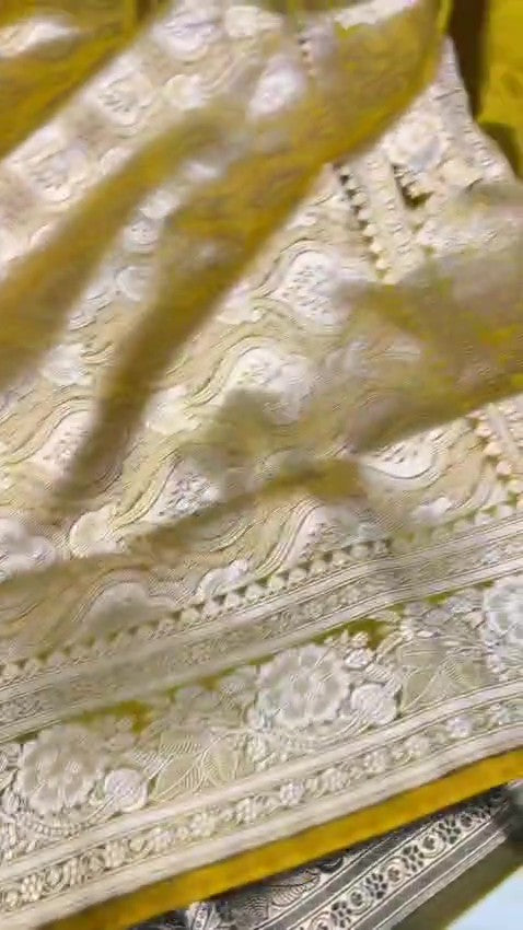 Olive Mustard Banarasi Mashru soft silk saree featuring intricate copper zari floral butas and an ornate traditional silver zari border.