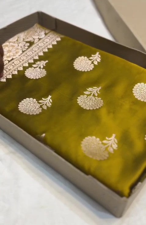 Olive Mustard Banarasi Mashru soft silk saree featuring intricate copper zari floral butas and an ornate traditional silver zari border.