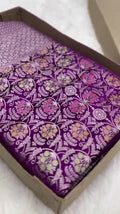 Purple Banarasi mashru soft silk saree featuring intricate golden zari floral jangla weaving, vertical pinstripes, meenakari highlights, and a ornate zari border.