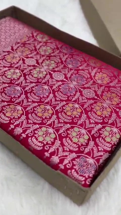 Rani Pink Banarasi mashru soft silk saree woven with intricate golden zari floral jangla jaal, vertical pinstripes, meenakari accents, and geometric borders.