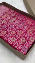Rani Pink Banarasi mashru soft silk saree woven with intricate golden zari floral jangla jaal, vertical pinstripes, meenakari accents, and geometric borders.