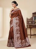 Model wearing a brown Banarasi Mashru soft silk saree detailed with intricate silver zari architectural and floral motifs