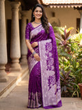 Elegant purple Banarasi Mashru soft silk saree detailed with shimmering silver zari woven borders and pallu.