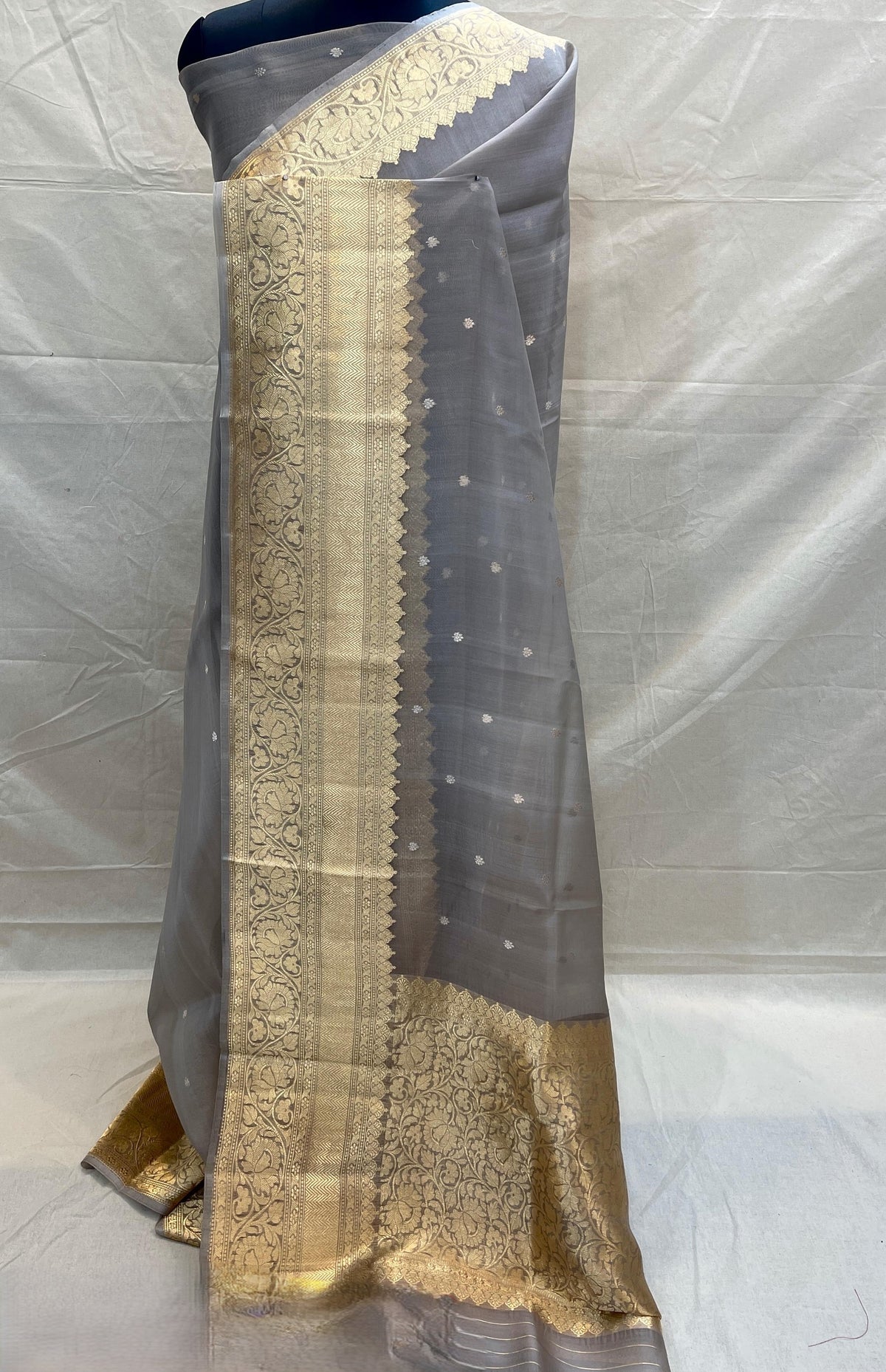Banarasi Handloom Kora Organza Silk Saree in deep green with intricate zari Kaduwa floral motifs and a rich contrast red brocade border with Silk Mark tag.