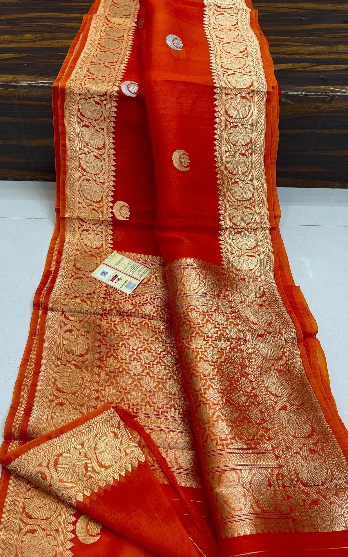 Banarasi Handloom Kora Organza Silk Saree in deep green with intricate zari Kaduwa floral motifs and a rich contrast red brocade border with Silk Mark tag