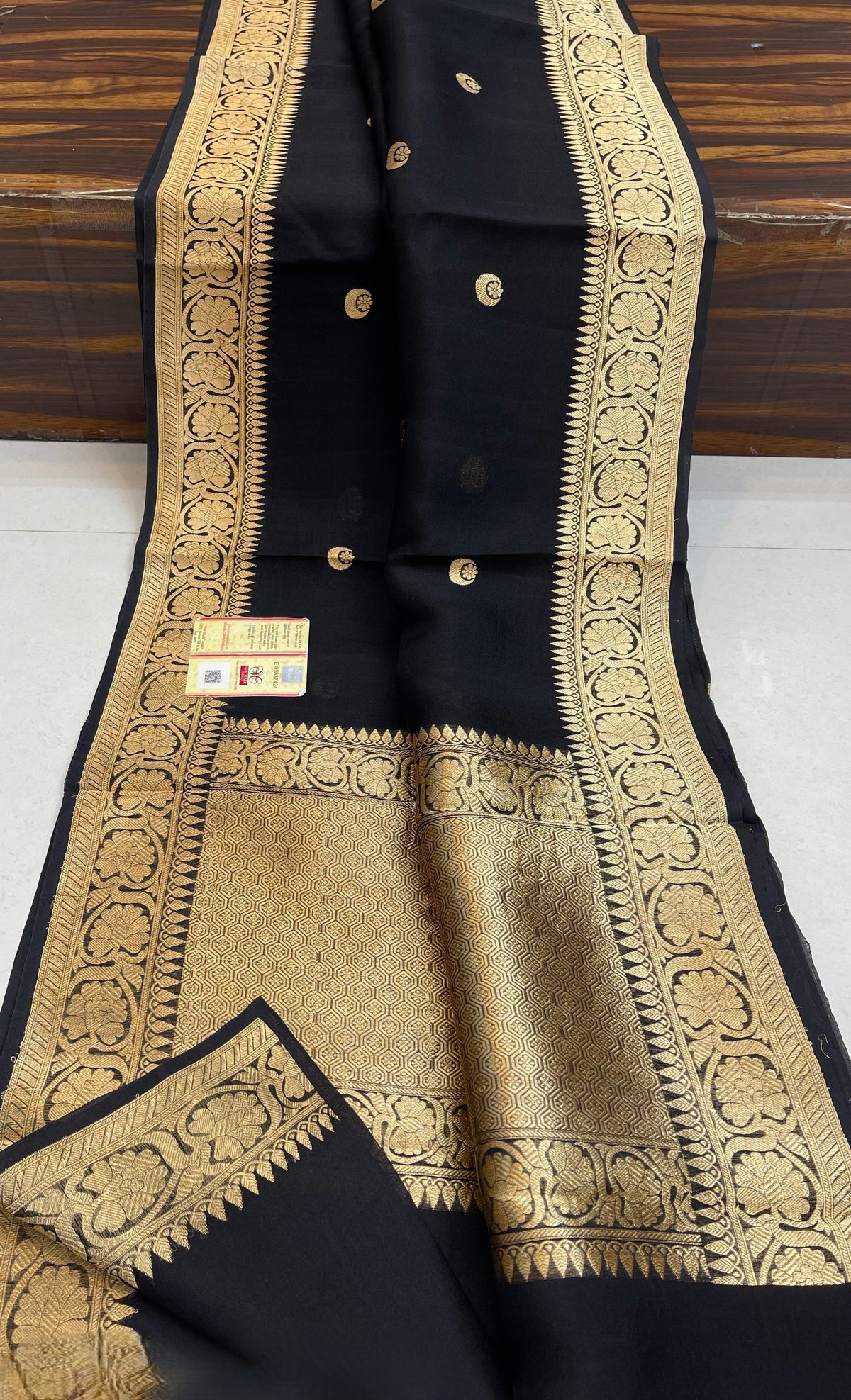 Banarasi Handloom Kora Organza Silk Saree in deep green with intricate zari Kaduwa floral motifs and a rich contrast red brocade border with Silk Mark tag