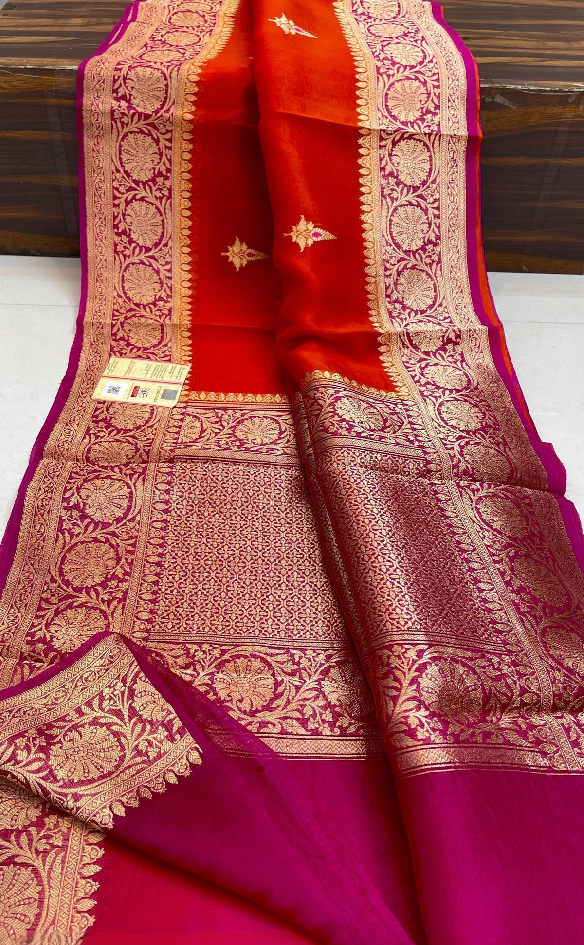 Banarasi Handloom Kora Organza Silk Saree in deep green with intricate zari Kaduwa floral motifs and a rich contrast red brocade border with Silk Mark tag