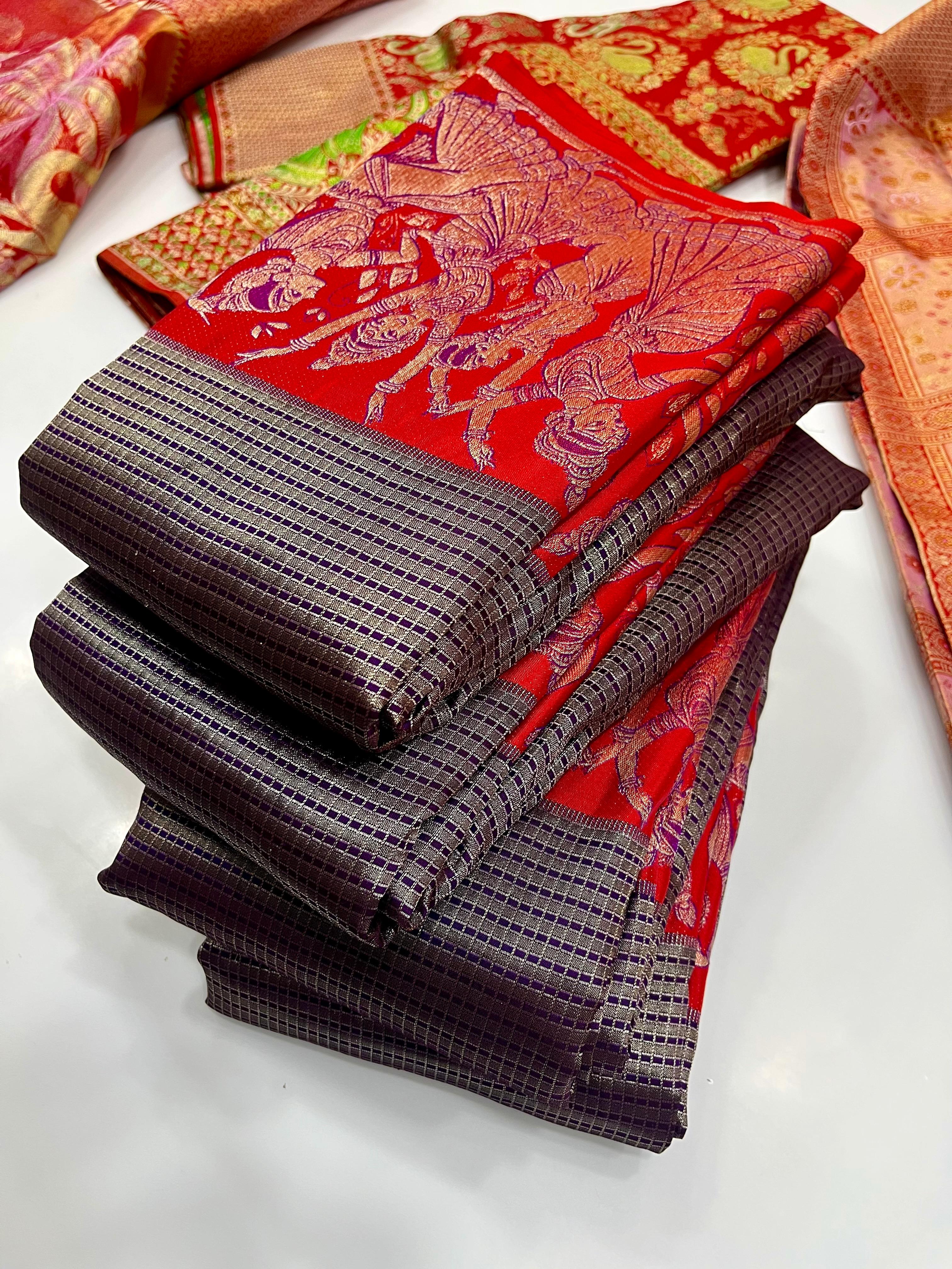 Navy blue Kanchipuram handloom silk saree featuring intricate Thanjavur Meenakari patterns, a bold red contrast border, and a matching red pallu.