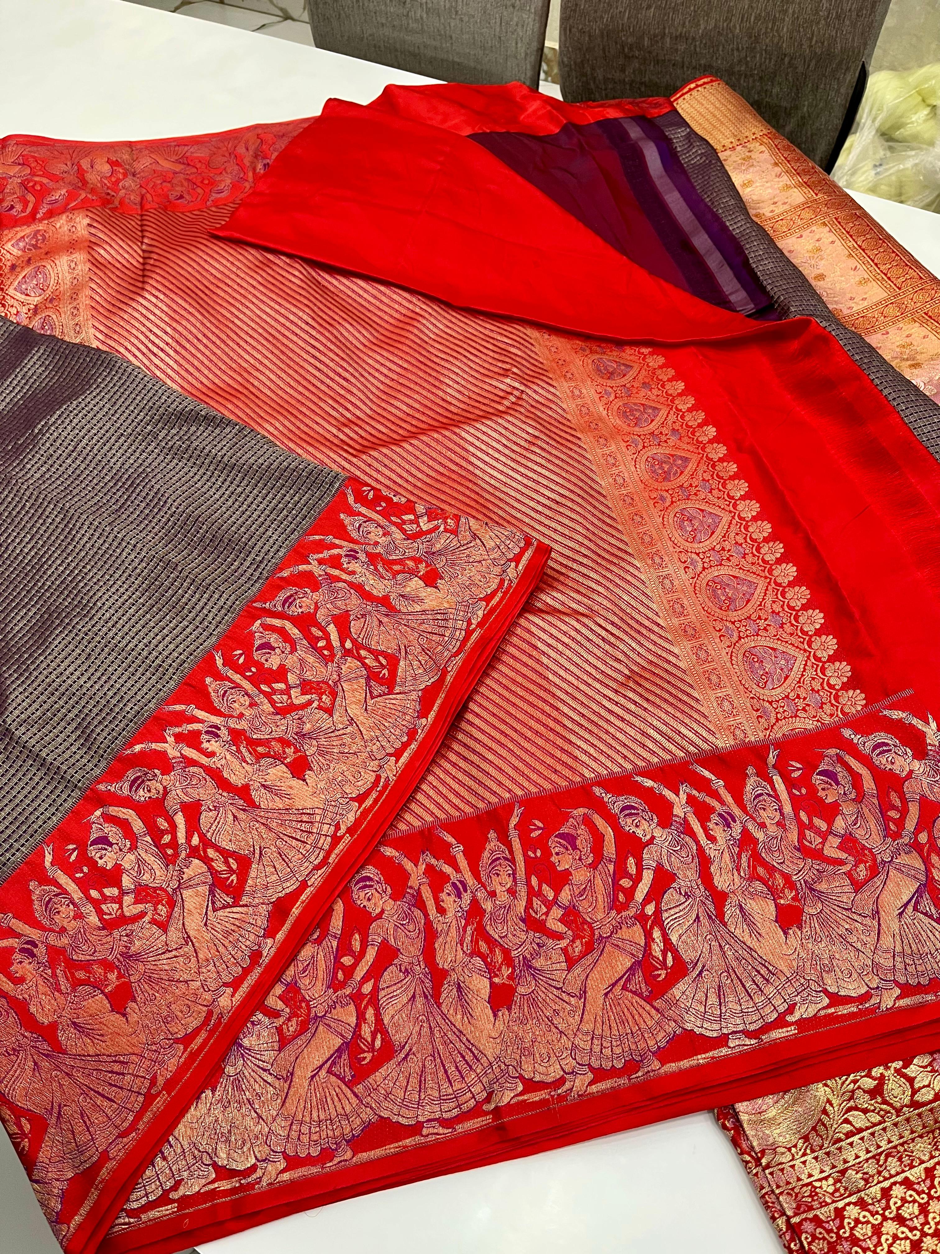 Navy blue Kanchipuram handloom silk saree featuring intricate Thanjavur Meenakari patterns, a bold red contrast border, and a matching red pallu.