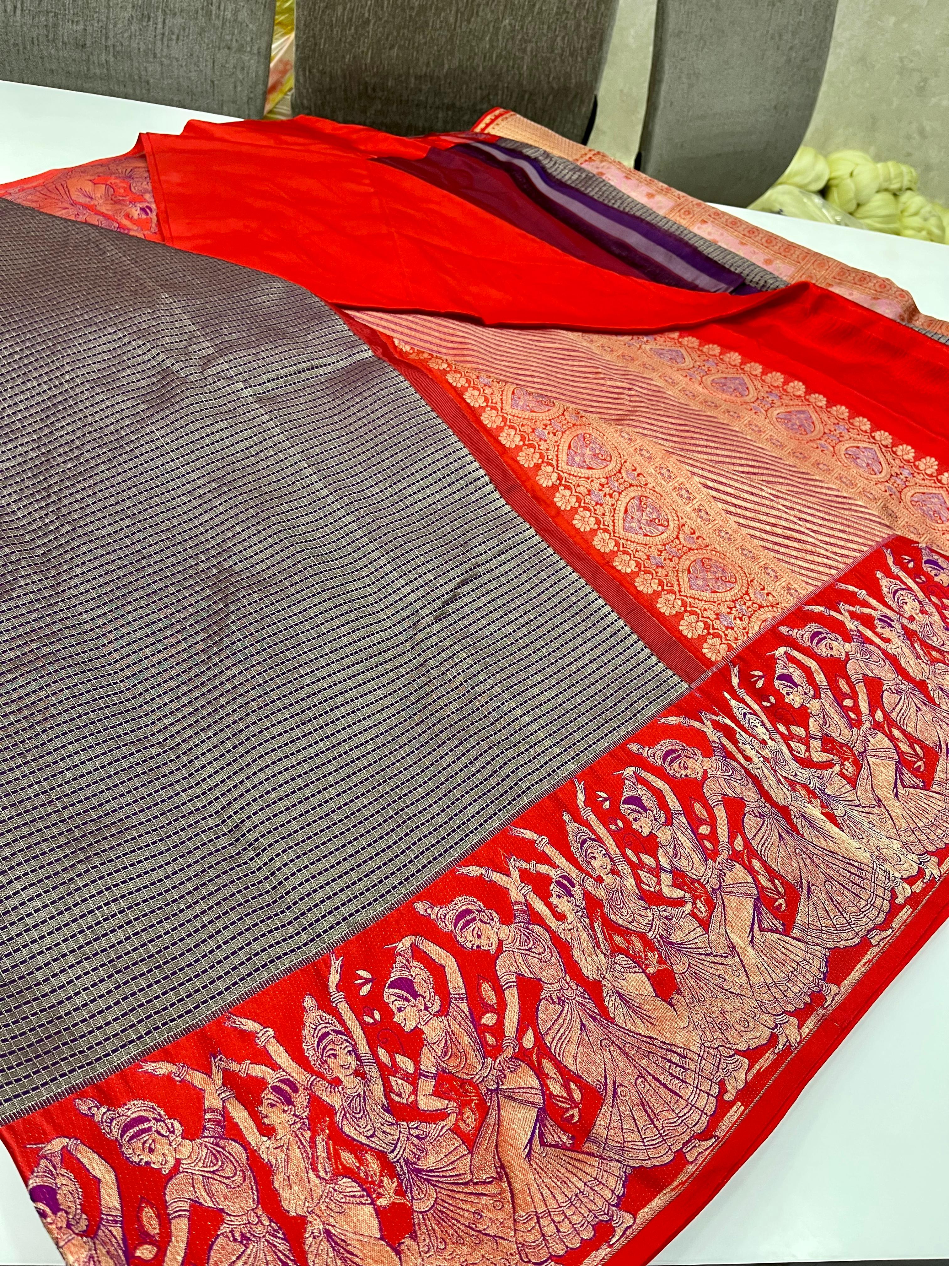 Navy blue Kanchipuram handloom silk saree featuring intricate Thanjavur Meenakari patterns, a bold red contrast border, and a matching red pallu.