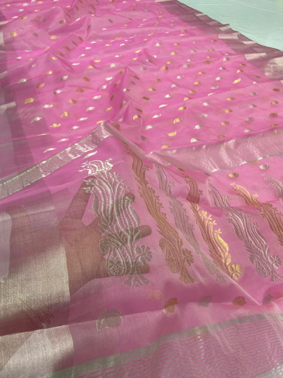 Pink Chanderi handloom katan silk saree featuring gold and silver zari borders and leaf buttas.