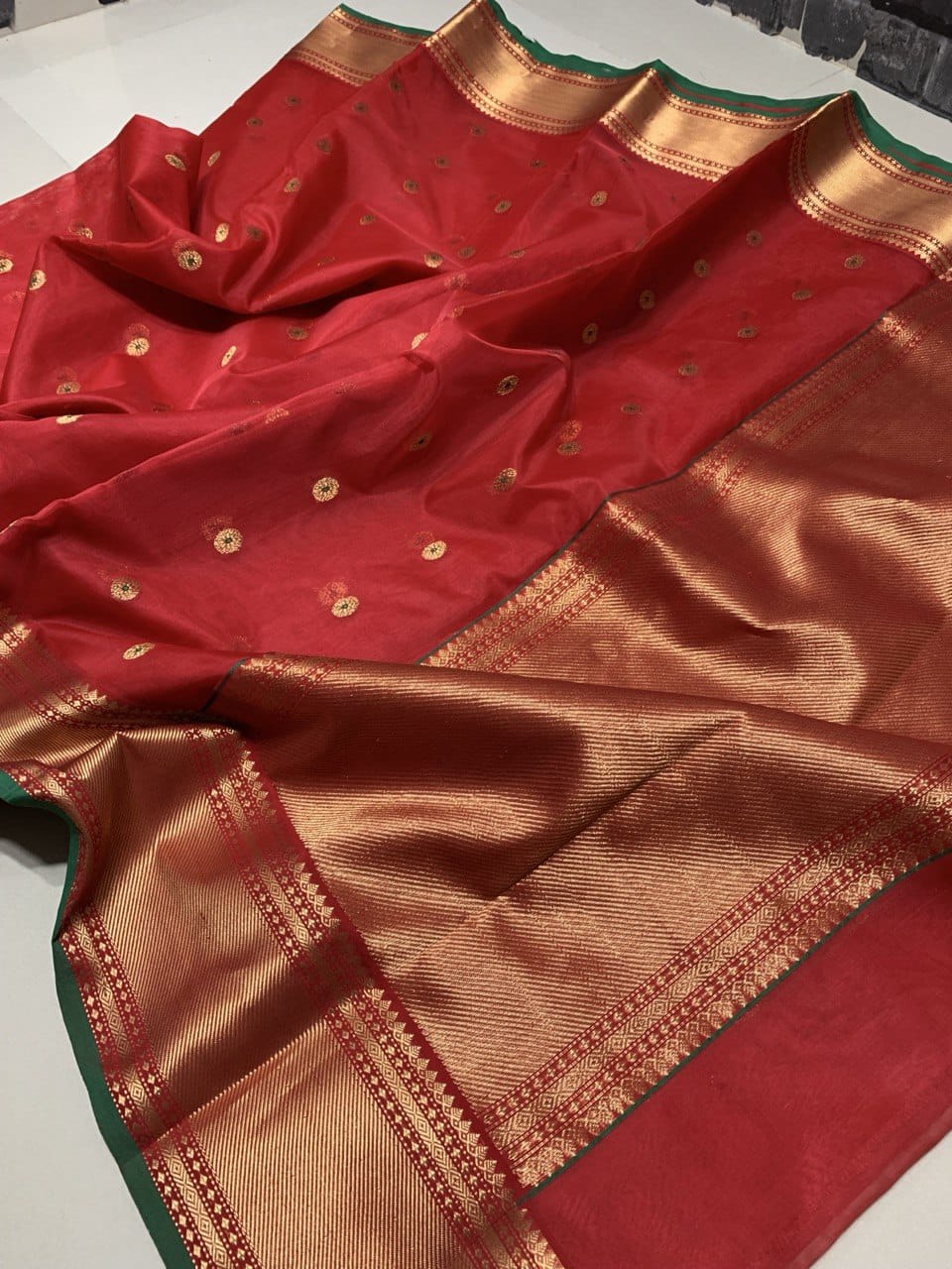 Red Chanderi handloom katan silk saree featuring intricate meenakari and nakshi weaving work.