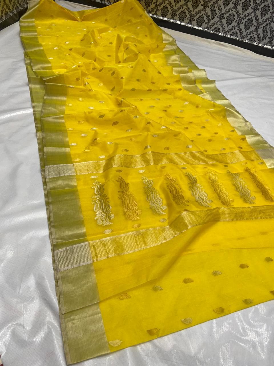 Golden Yellow Chanderi handloom katan silk saree featuring gold zari buttas and a matching border.