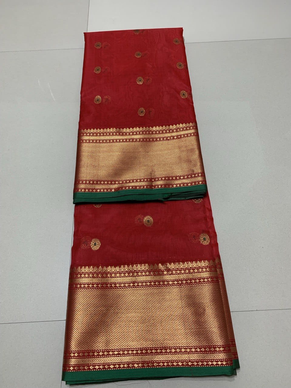 Red Chanderi handloom katan silk saree featuring intricate meenakari and nakshi weaving work.
