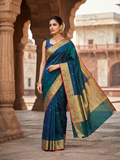 Elegant model wearing a peacock blue Chanderi handloom katan silk saree featuring intricate multicolored meenakari handwork and gold zari borders.