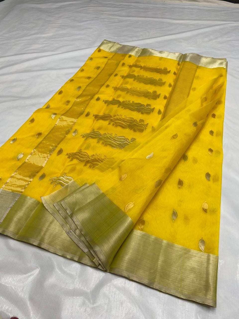 Golden Yellow Chanderi handloom katan silk saree featuring gold zari buttas and a matching border.