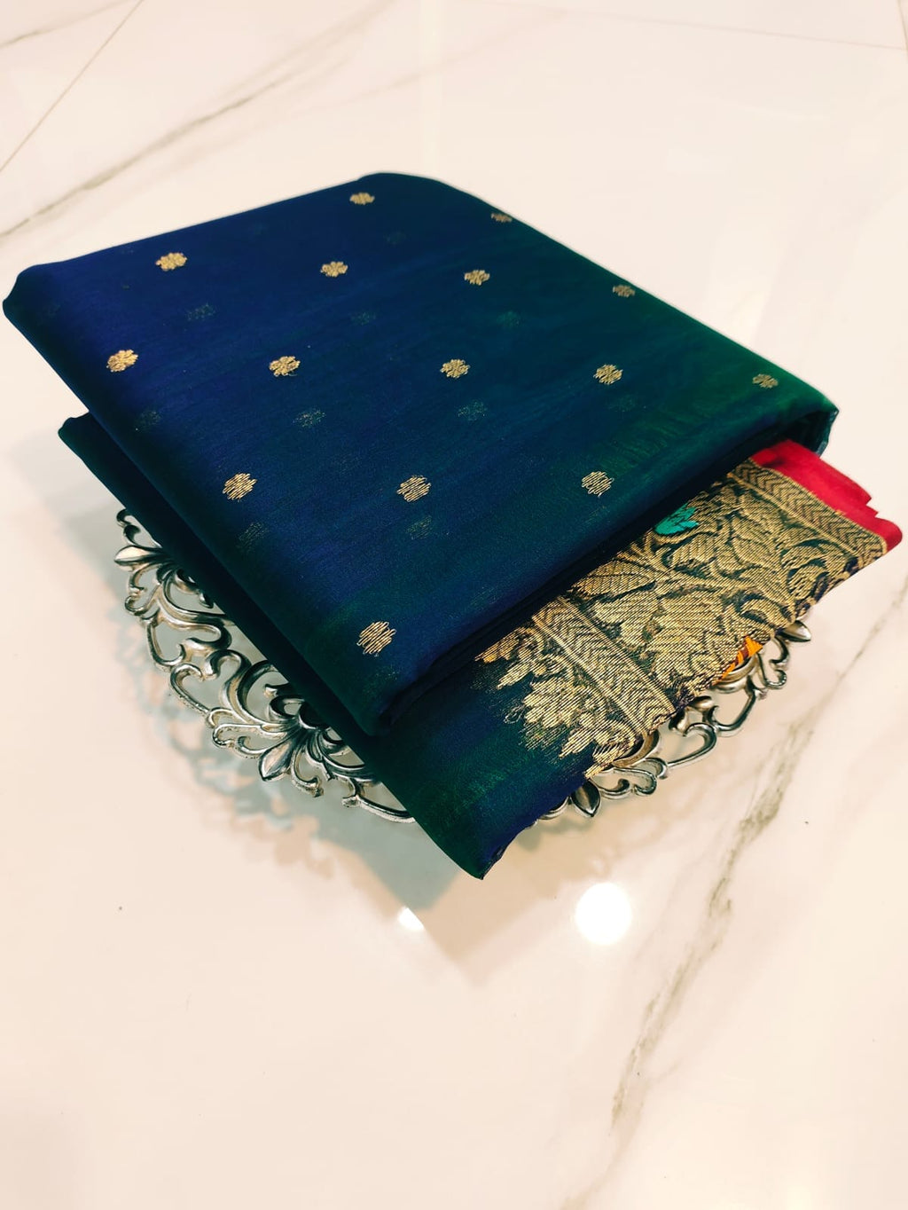 Peacock Blue Chanderi handloom katan silk saree featuring intricate multicolored meenakari handwork and gold zari borders.