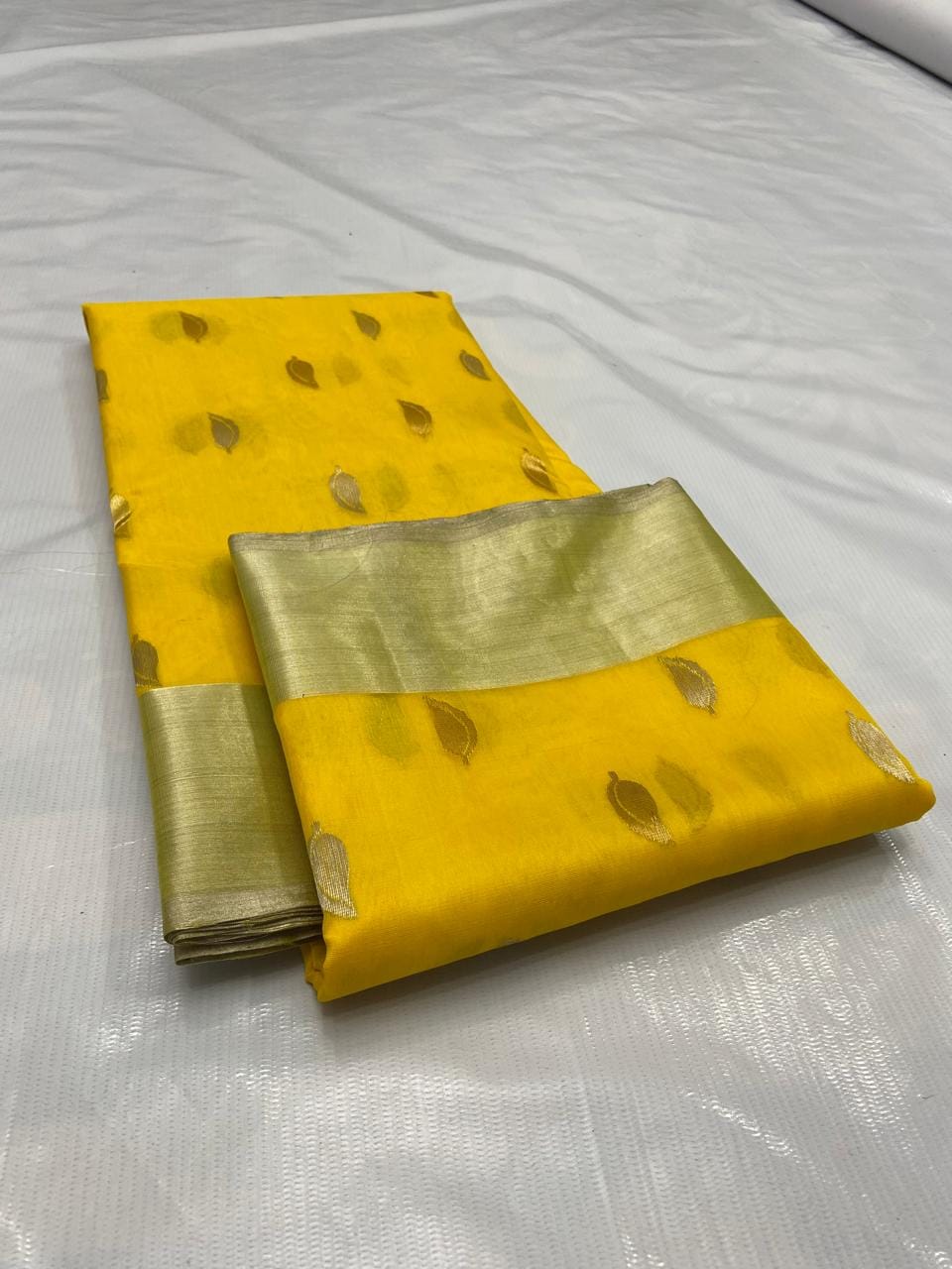 Golden Yellow Chanderi handloom katan silk saree featuring gold zari buttas and a matching border.