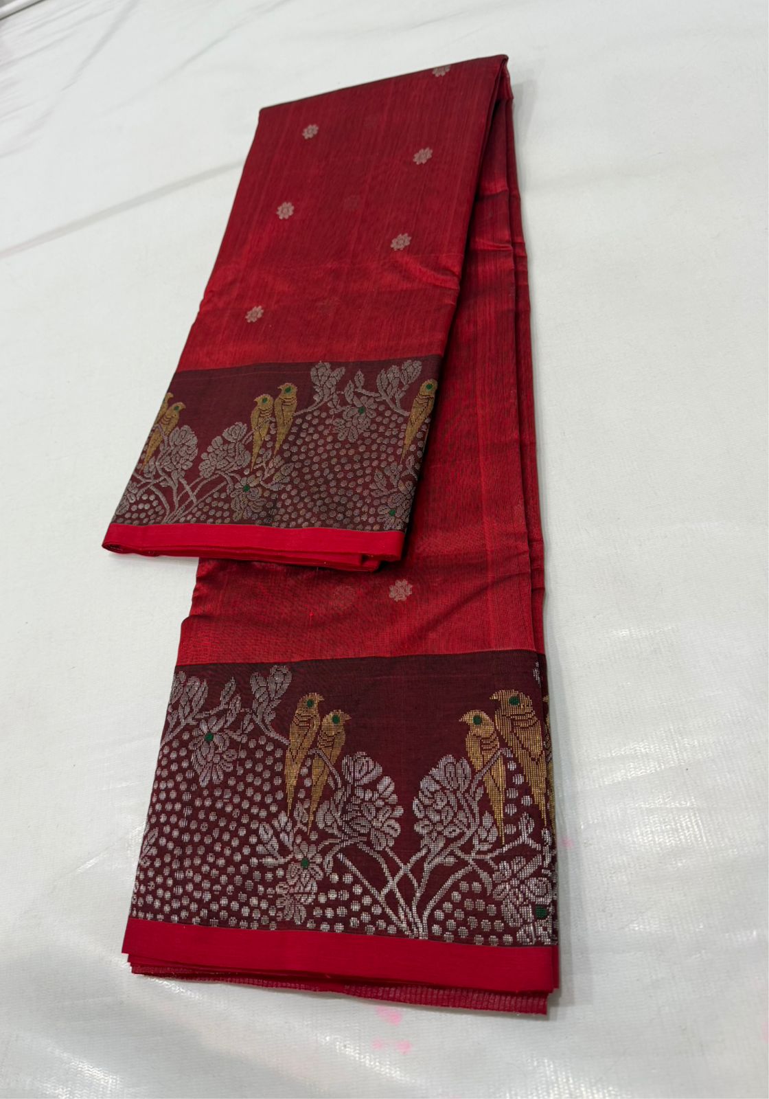 Chanderi handloom pattu silk saree featuring a dark maroon zari border with intricate gold bird motifs, styled with a matching blouse
